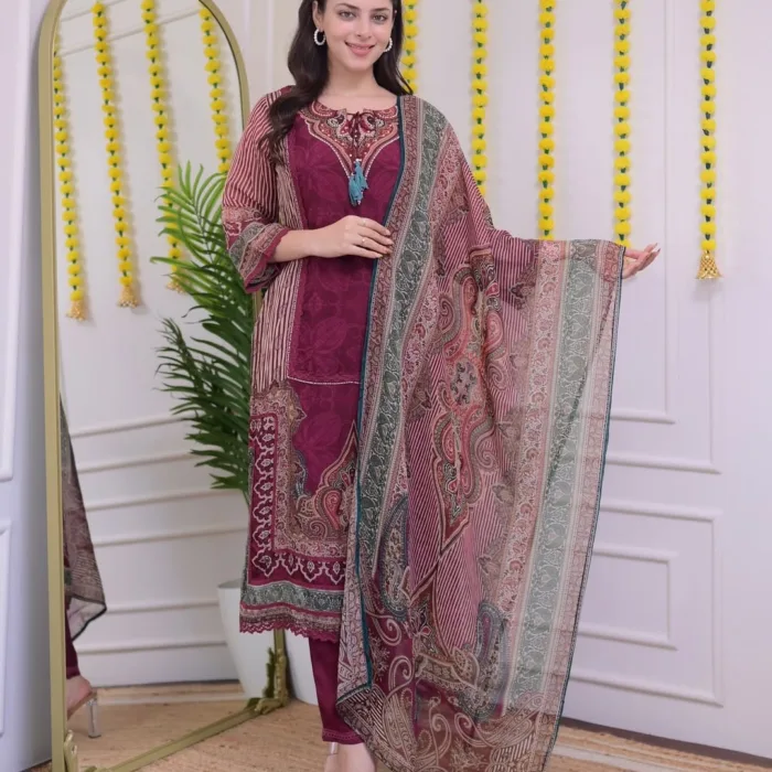 This elegant Maroon Printed Embroidered Suit Set is a harmonious blend of traditional print and light embroidery, tailored from comfortable muslin fabric. With its classic neckline and vertical sleeve stripes, it’s ideal for festive occasions or office wear. Includes a straight kurta, matching pants, and printed dupatta for a complete ethnic look.
