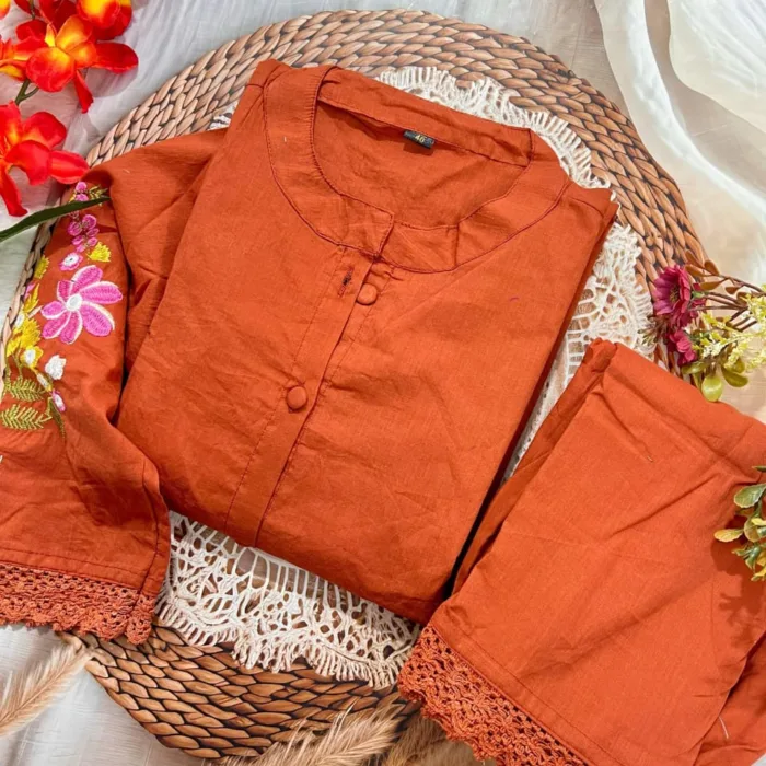 his rust orange co-ord set is a perfect blend of elegance and comfort. Adorned with floral hand embroidery on the sleeves and back, and finished with delicate crochet lace on the top and bottom, it’s a stylish pick for everyday fashion.