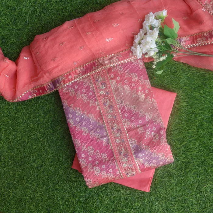 CharmingElegant Peach Printed Cotton Suit Set with Dupatta. Perfect for a stylish and comfortable look.
