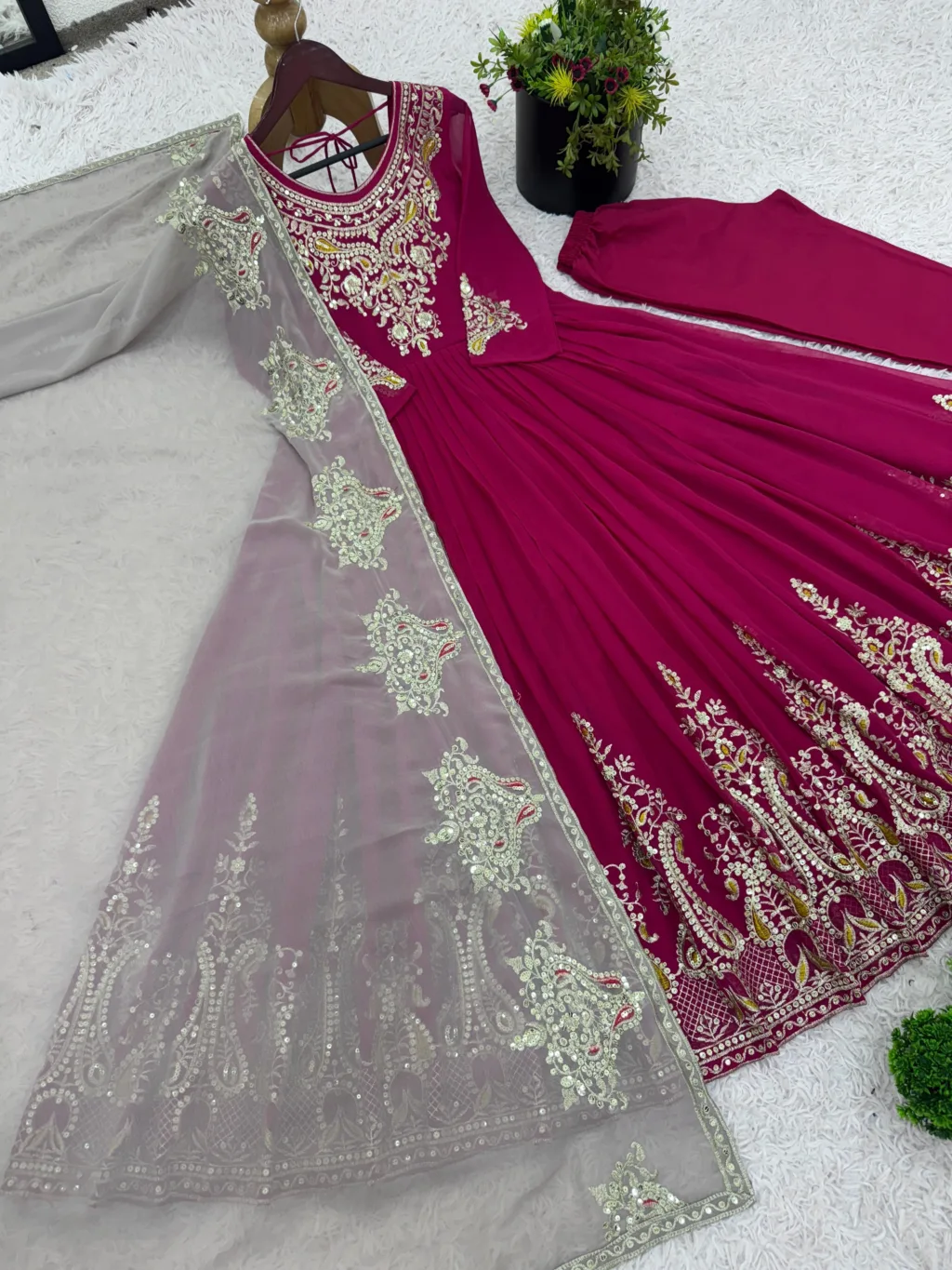 Unleash timeless grace with this show-stopping magenta Anarkali suit, exquisitely embroidered with golden motifs and paired with a dreamy beige dupatta. A perfect pick for weddings, festivals, and elegant evenings.