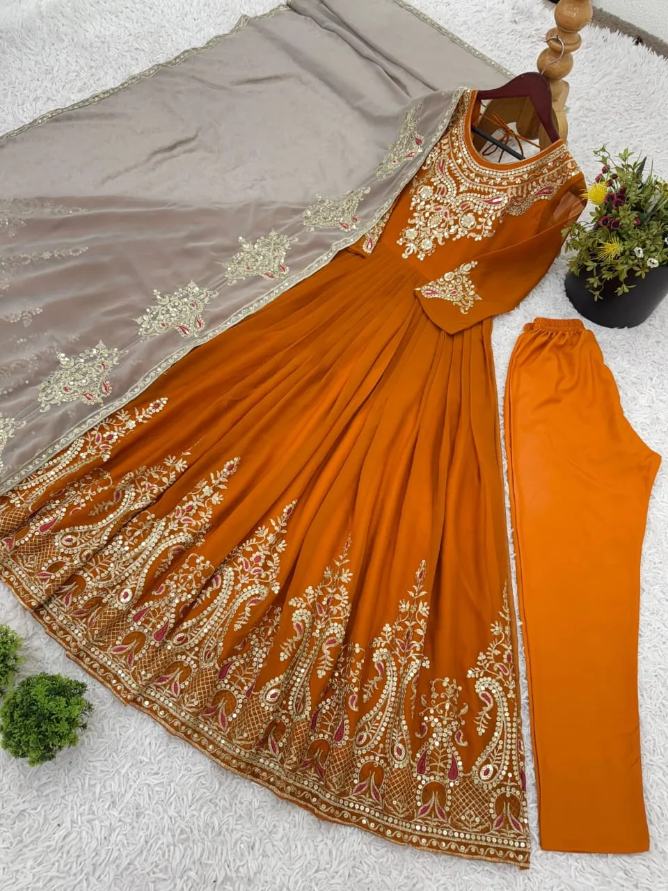Unleash timeless grace with this show-stopping mustard Anarkali suit, exquisitely embroidered with golden motifs and paired with a dreamy beige dupatta. A perfect pick for weddings, festivals, and elegant evenings.