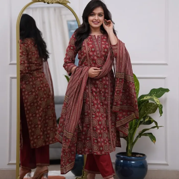 Graceful Maroon Ethnic Printed Cotton Suit Set with traditional prints, solid pants, and a matching printed dupatta. Ideal for casual, festive, and work wear.